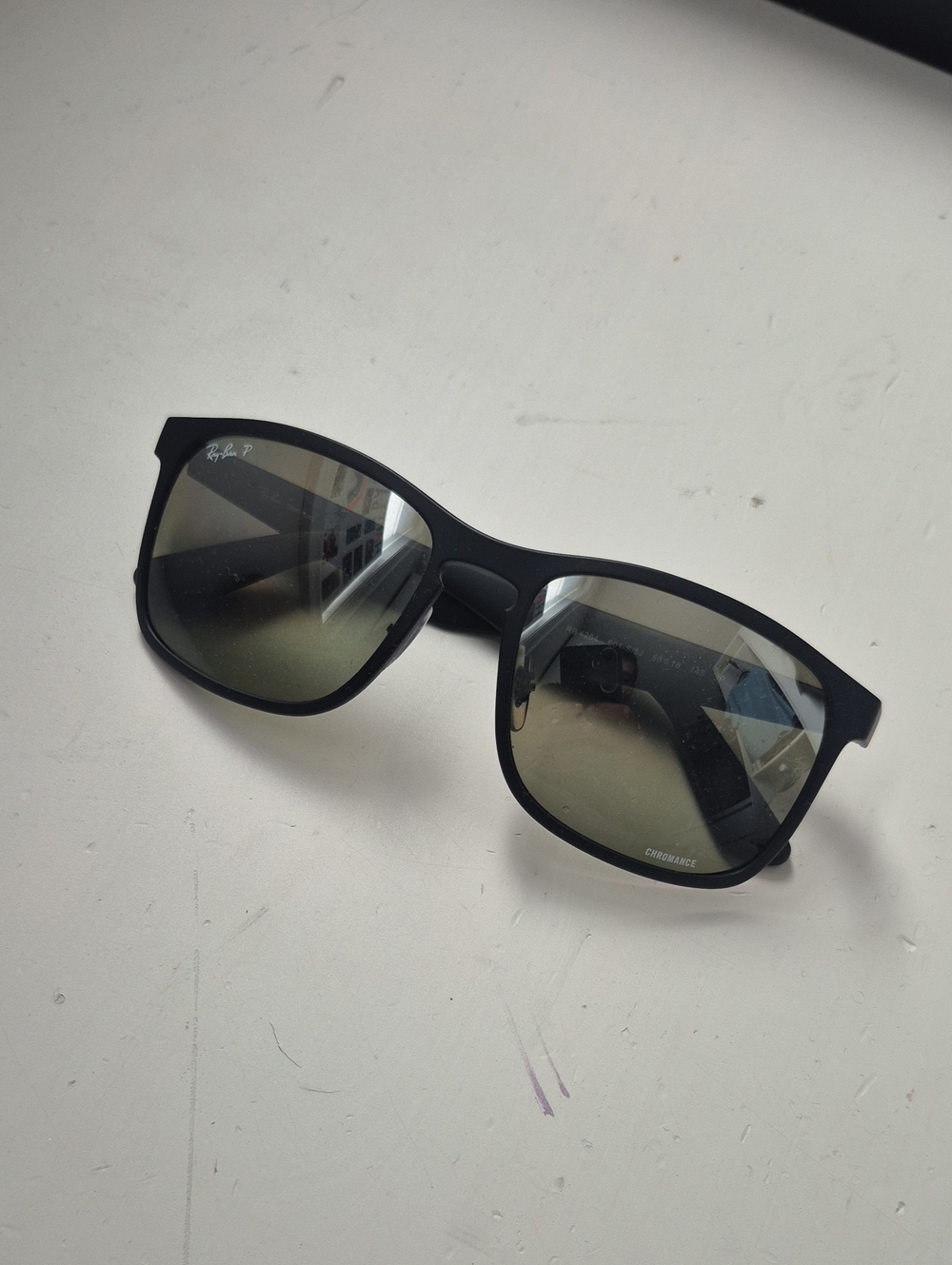 Ray-Ban Matte Black Frame Sunglasses with Green-Tinted Lenses